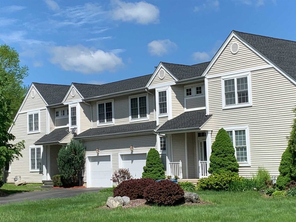 Commercial-Roofing-Contractor-Townhouses-Worcester-MA-2 photo of townhouses with roof replaced by Northeast Home & Energy Roofing Contractors